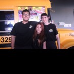 John Bonilla, Maria Bustes, and Alex Strong (from left) enjoy their job at Bernie’s Burger Bus, seating and serving customers.