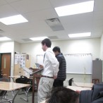 Aaron Birenbaum questions a student from Greenhill at the Glenbrooks tournament.