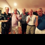 (From left) Pat Reddy, Rich Maloney, Ken Kades, Howard Dyer-Smith and Mike Brier, holding roses for their wives.