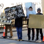 Kids holding signs