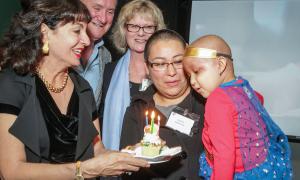 Mady and Ken Kades, Leslie Bourne (RMH Houston CEO) and Rossio Sandoval with her daughter Sophia