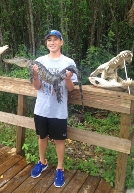 Jacob Padden enjoys traveling and trying new and interesting things such as when he held this alligator at the Everglades National Park in Homestead, Florida. The trainer said, “I’ve only been bit twice in my 15 years of training alligators.” He had the s