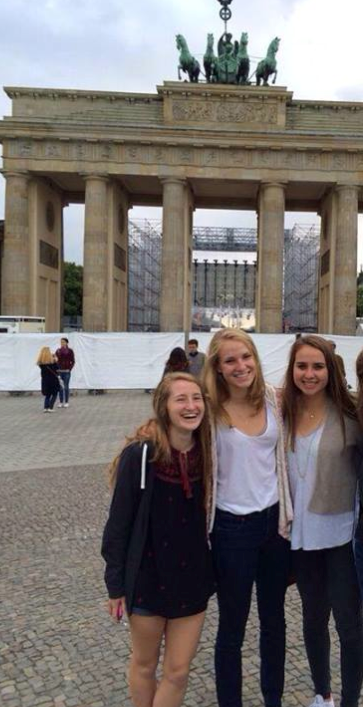 Friends Rebekah Koehn, Katie Ohman, and Arabella Benavides in front of the Brandenburg Gate in Berlin, Germany.