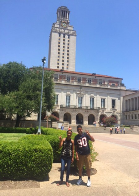 Sidney Phillips and her cousin, Aaron Pirtle, also a high school senior, making the Longhorn hand signal in front of the Tower at The University of Texas in Austin, Texas.