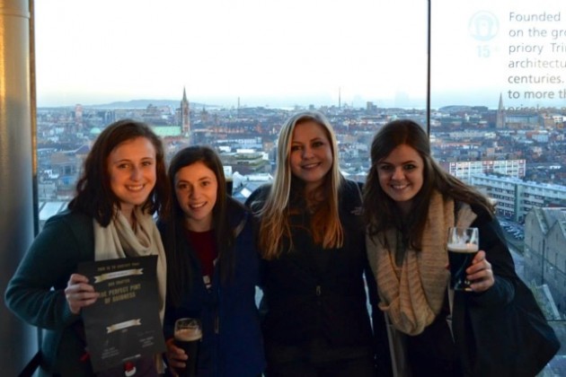 Michelle Nussbaum, Alison Doherty, Sarah Jane Knowlton, and Stephanie Shaw enjoying the beautiful view of Dublin at the top of the Guinness factory after learning how to properly pour a Guinness.