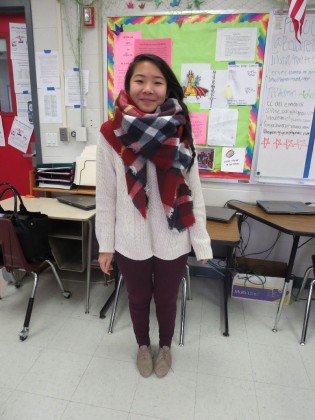 Rena Li, a senior, is wearing a sweater from Urban Outfitters, a scarf from Zara, pants from Anthropologie and shoes from DSW. 