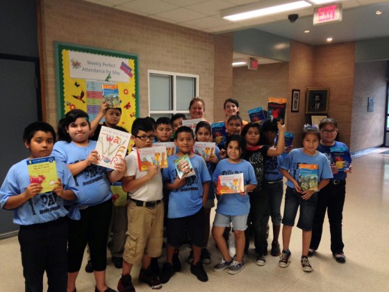 Claudia Heymach (10th from the left, in back) with Davila Elementary School students, dropping off children’s books.