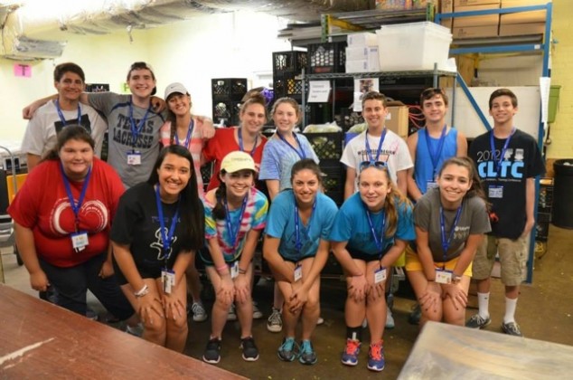 Pictured: Matthew Hall (back row, second from left) and friends after working at the Arlington Food Assistance Center. (Photo: Blake Ruskin.)