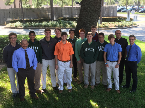 (From left) Brandon Bain, theology teacher Mr. Tommy Romano, Martin Montalvo, Nick Tanner, Felix Read, Patrick Sullivan, Toan Cao, Austin Miller, Jeremy Brown, Michael Blaschke, Thomas Neiers, Brandon Solcher, Fr. Flavio Bravo, Jesuit Father, Head of Past