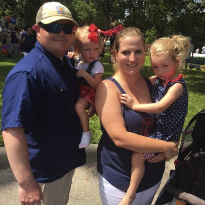 Jonathan Fincher holding Payton and Hope holding Rebekka.