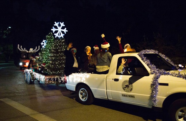 Parade participants wave