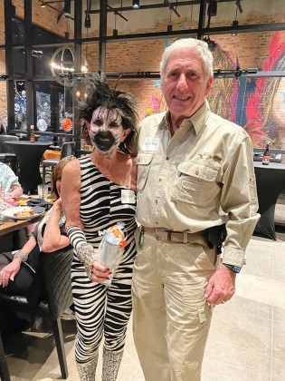Lindy Kahn (zebra) and Sandy Kahn (game hunter)