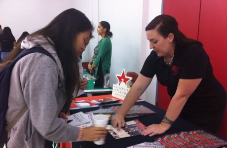 Left: Ashley Truong, a junior, talking to a college coordinator from the University of Saint Thomas.