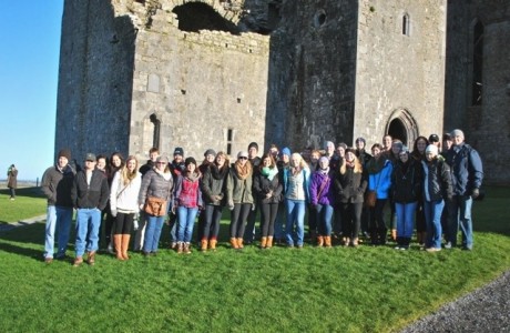 A group photo in front of the Rock of Cashel in Cashel, Ireland.