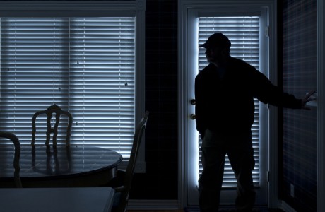 Burglar breaking in at night