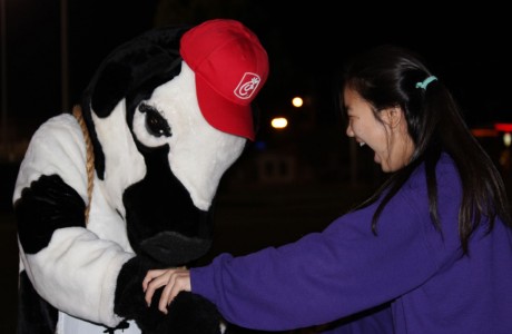 A cow from Chick-fil-A offers a dance to junior Hannah Lee while promoting the restaurant. Chick-fil-A sold dinner is at the Fifth Quarter, and also promoted the upcoming Chick-fil-A across from Stratford on Dairy Ashford. 