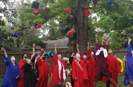 Tossing caps in the air