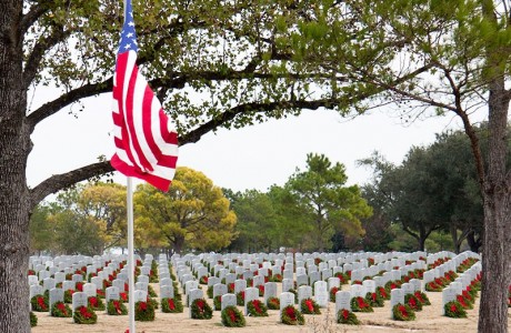 American flag by gravestones