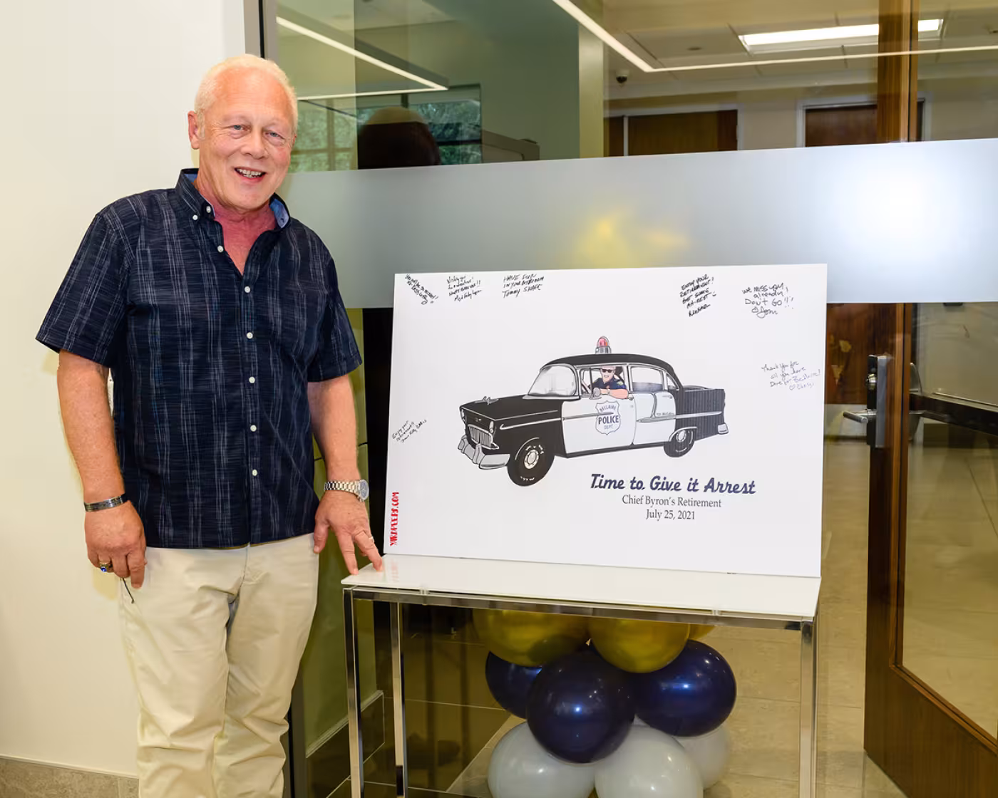 Byron Holloway with sign