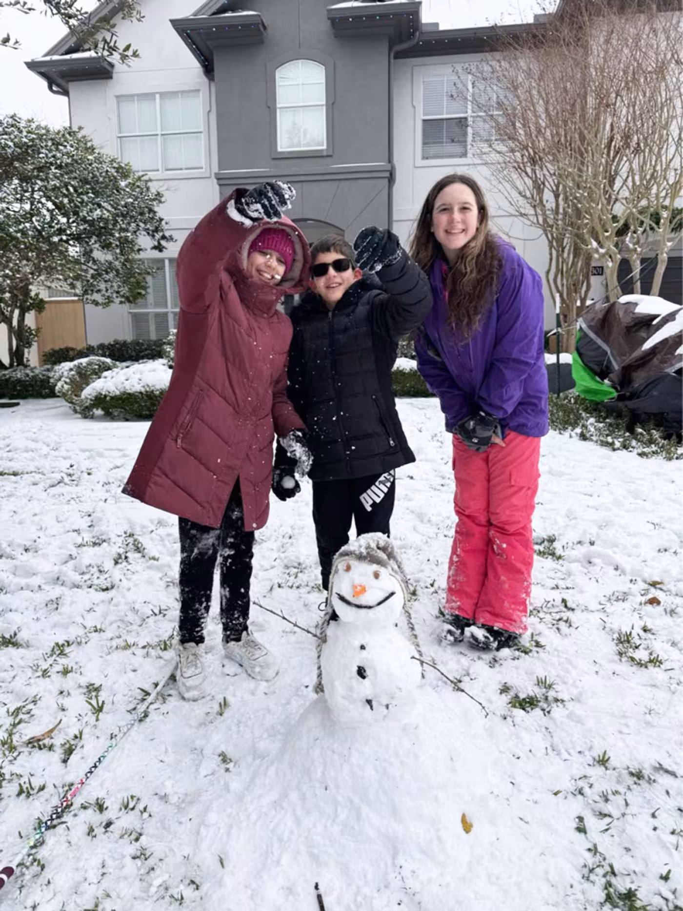 kids with snowman