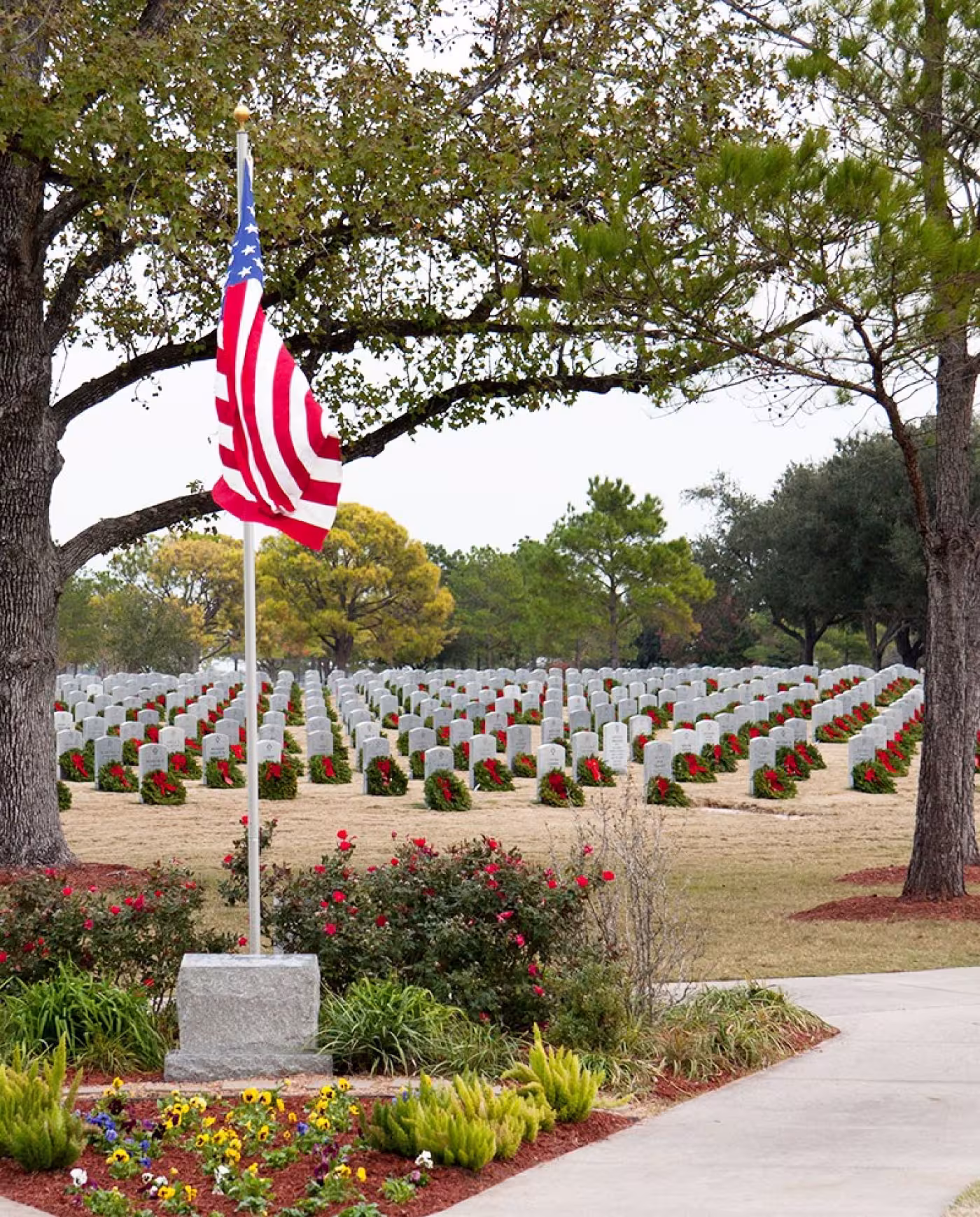American flag by gravestones