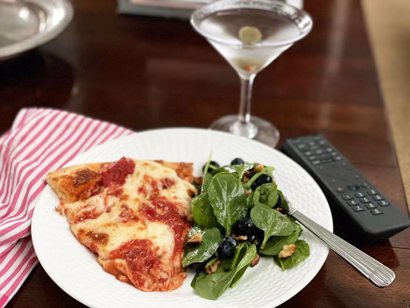 Pizza, blueberry spinach salad, martini,
