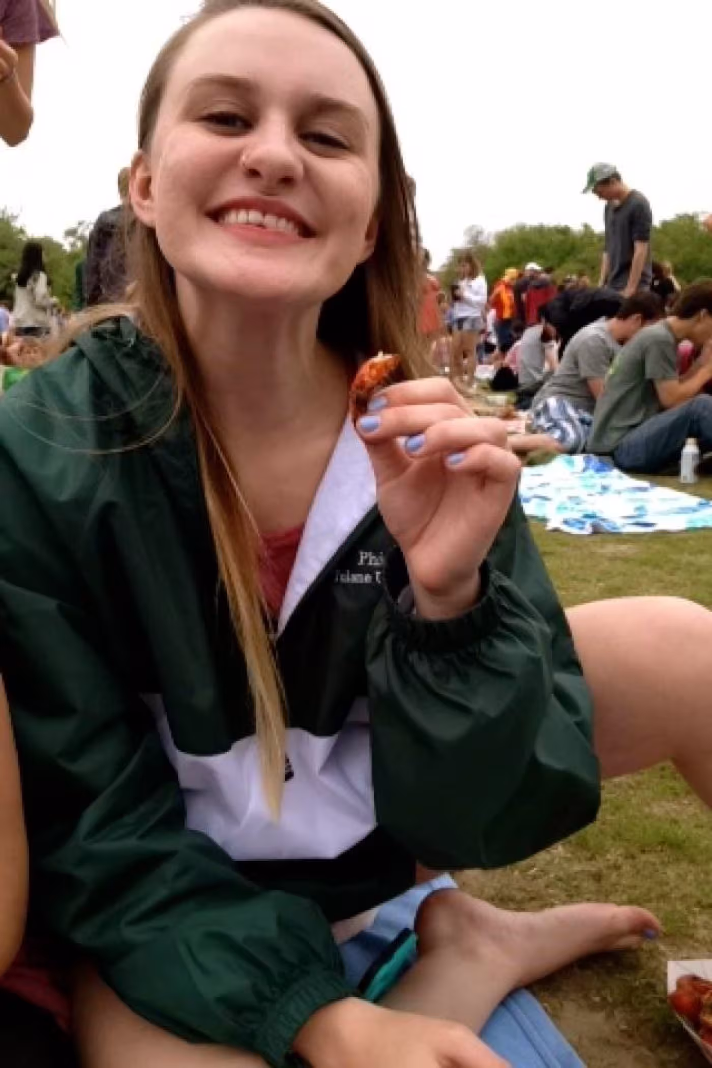 Elisabeth Lyles loves to try anything new. Here, at Tulane’s Crawfest, she tried her first crawfish.