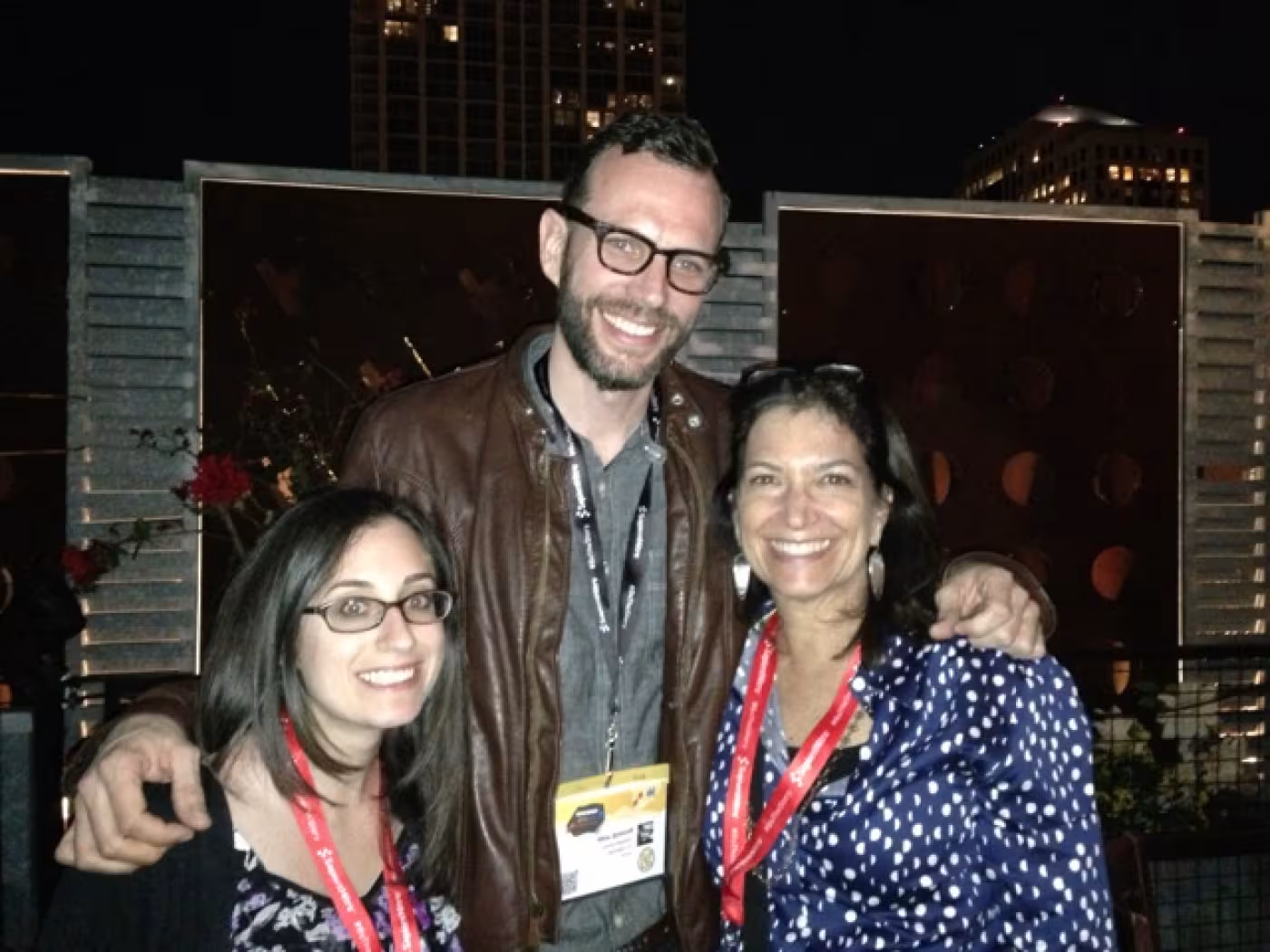 Jordan and Joni discussing online media with Mike Schmidt, Multimedia Director at National Geographic, at a networking party at Fogo de Chao.