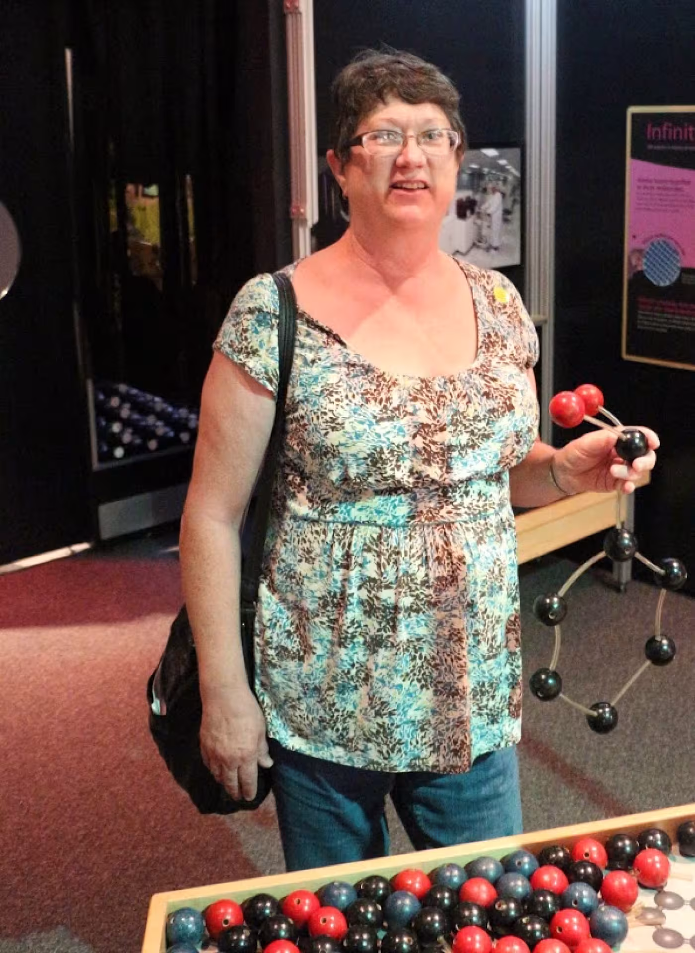 MD Anderson nurse Rebecca builds her own molecule by “bonding” atoms together.