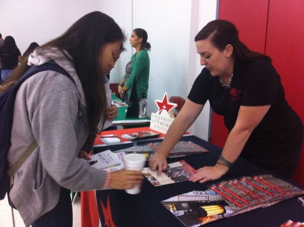 Left: Ashley Truong, a junior, talking to a college coordinator from the University of Saint Thomas.