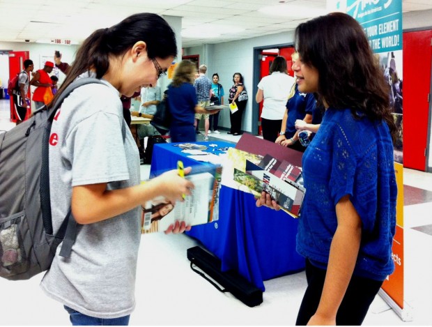 (From left) Nelly Li and Hunain Malik, both juniors, compare their different college choices.