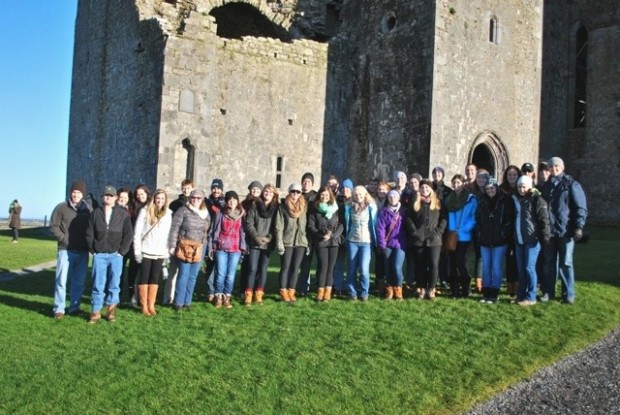 A group photo in front of the Rock of Cashel in Cashel, Ireland.