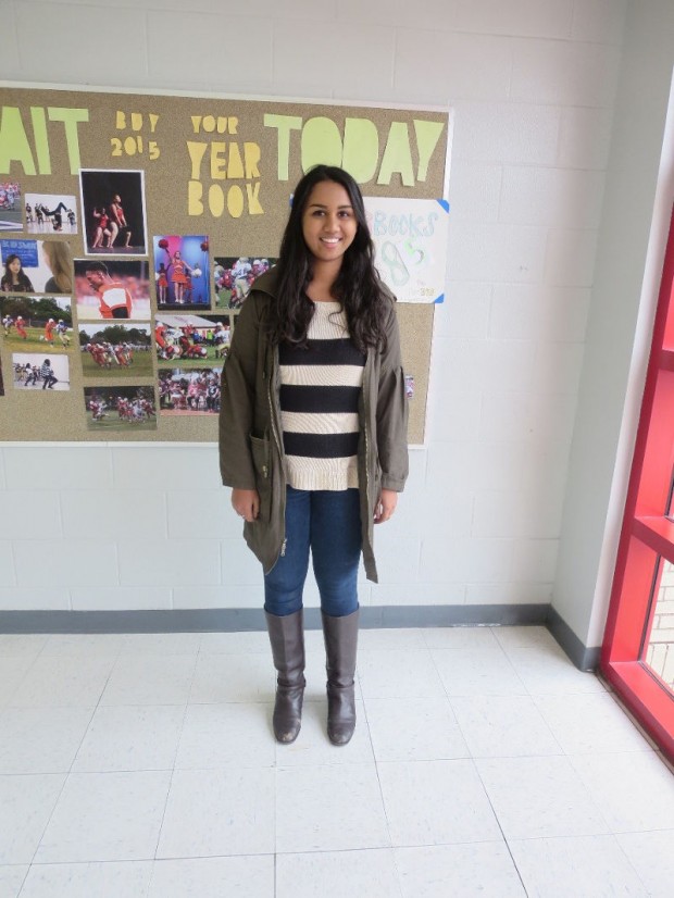 Krishna Sigireddi, a senior, is wearing a jacket from Marshalls, sweater from Ann Taylor Loft, jeans from Hollister and Cole Haan boots. 