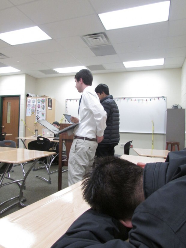 Aaron Birenbaum questions a student from Greenhill at the Glenbrooks tournament.