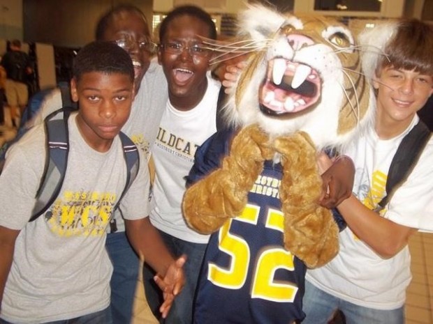 Deiondre Jones, Ben Ukot, Howard Mokolo and Gabe Weber (from left) pictured here as freshmen pose with the Westbury Christian wildcat mascot.