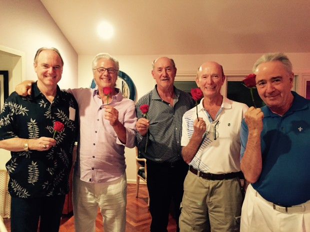 (From left) Pat Reddy, Rich Maloney, Ken Kades, Howard Dyer-Smith and Mike Brier, holding roses for their wives.