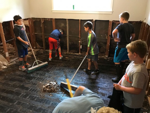 Boys helping clean up