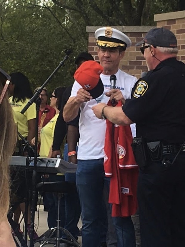 Police cap and Astros hat