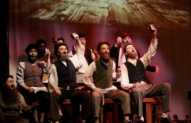 Boys holding up glasses