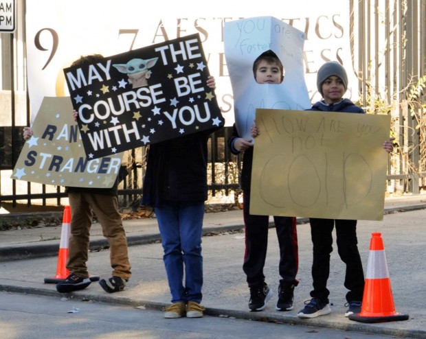 Kids holding signs