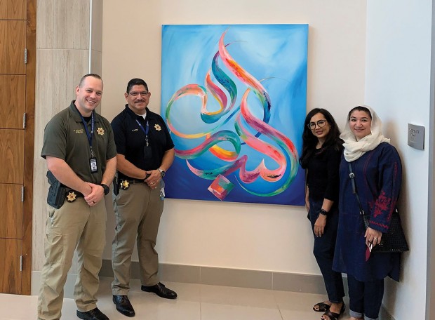 Officer Chase Liccketto, Bellaire Police Chief Mo Lopez, artist Hina Chaudhry, and Mona Sharique