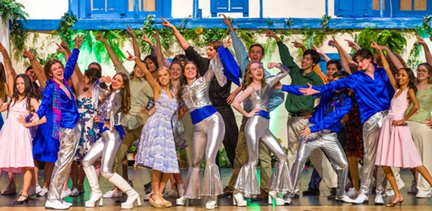 The cast of Mamma Mia during bows on closing night.