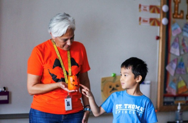 teacher and student with pumpkin