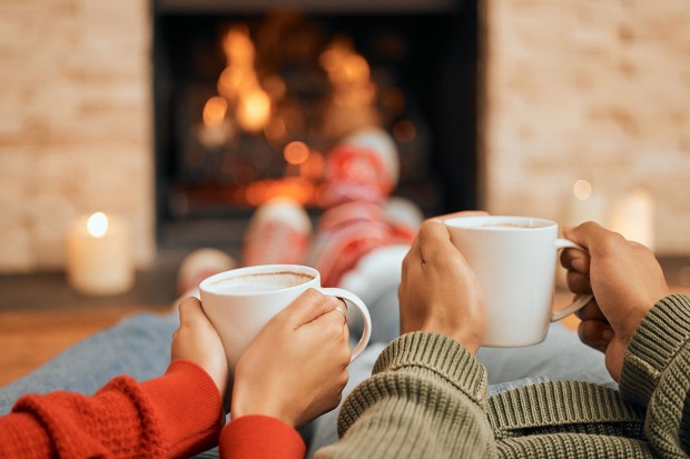 hot cocoa by fireplace