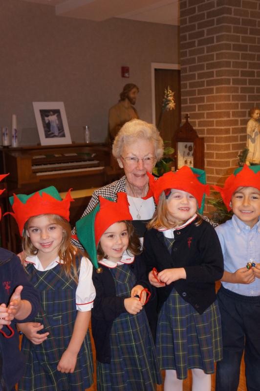 Sister Virginia O'Donell with pre-k students from St. Vincent de Paul Catholic School.