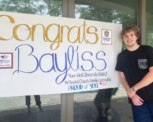 Bayliss Baker with sign
