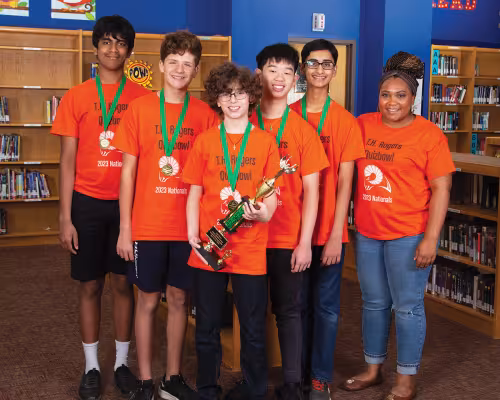 Achudh Karunakaran, Sean Boyle, Leonidas Boukas, Long Nguyen, and Arjun Chhibber with their coach, Chelsea Timmons.