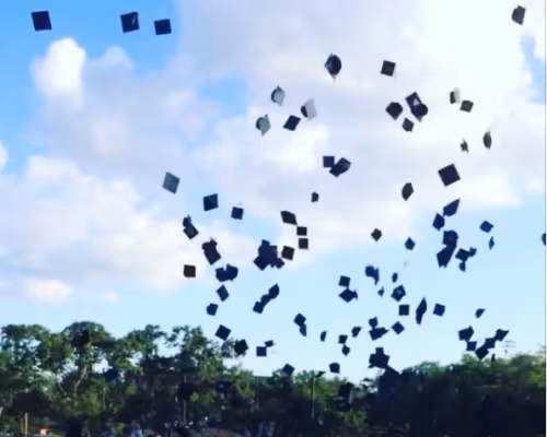 Pictured are the students of the Class of 2014 celebrating their graduation with the tradition of throwing their caps in the air. (Photo: Madi McIntyre)