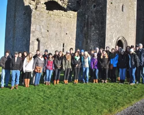 A group photo in front of the Rock of Cashel in Cashel, Ireland.