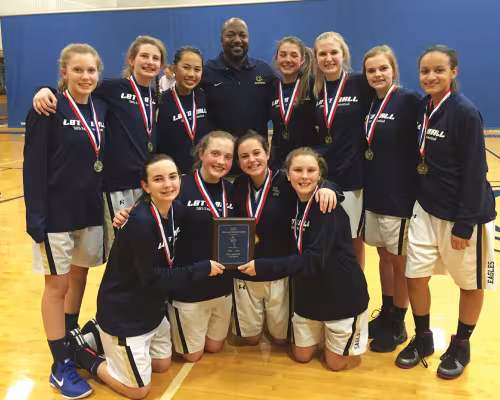 The Second Baptist School eighth-grade girls’ basketball team